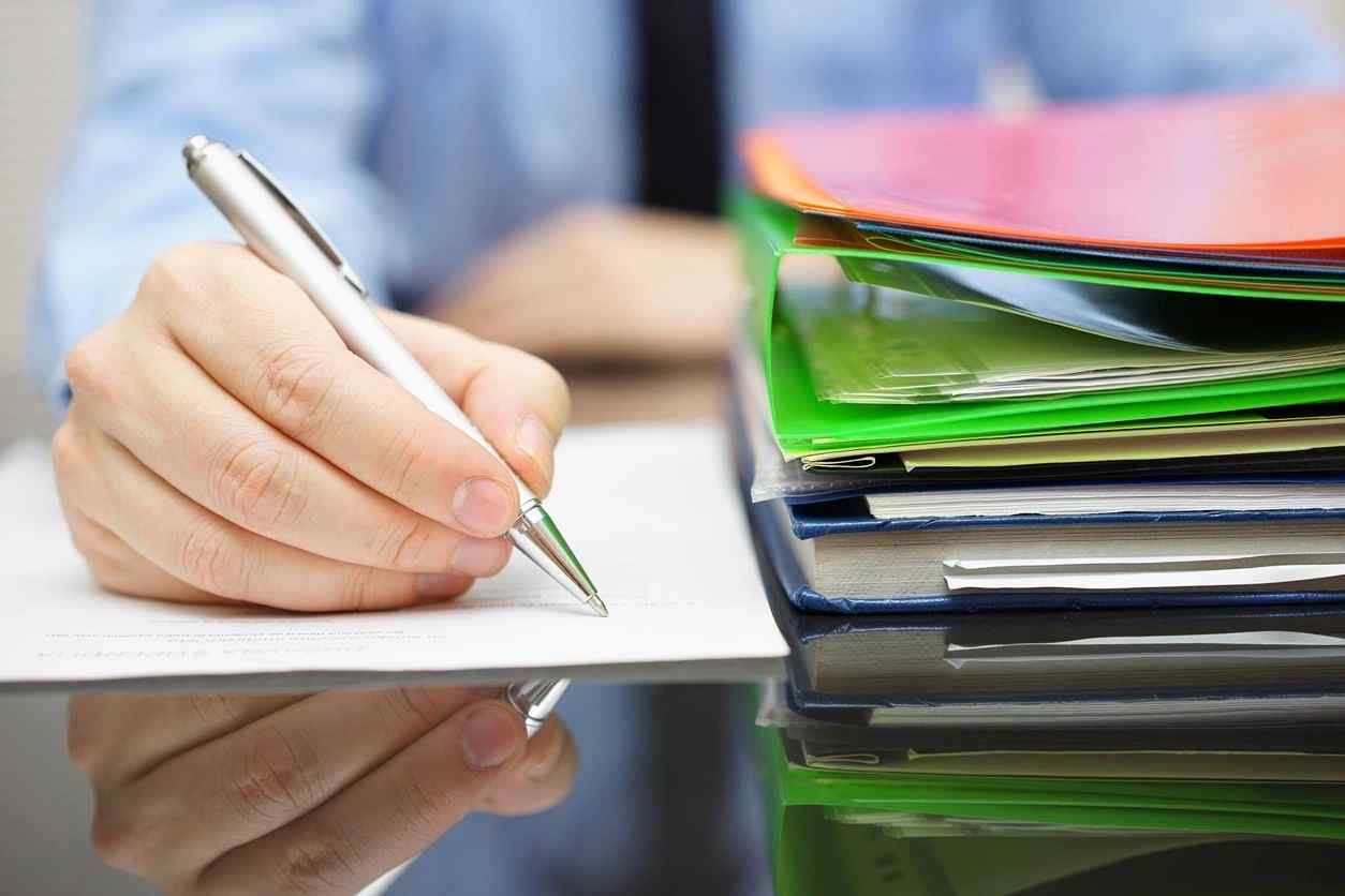 A man preparing a document for document scanning in Toronto